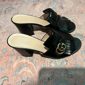 Gucci Black Leather Fringe Mules with Gold GG Emblem